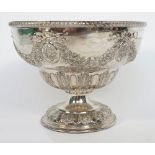 A silver bowl, of circular form, embossed with floral and foliate swags,