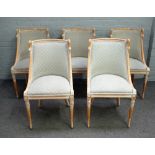 A set of five limed beech tub back dining chairs, with swan head mounts, on splayed supports,