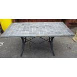 A 20th century rectangular garden table with square slate mosaic top, 90cm wide x 159cm long.