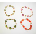 A cornelian bead bracelet, a pink tourmaline bead bracelet and two green stone bead bracelets,