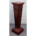 A 20th century mahogany jardiniere stand, with blind fret tapering square column, on square base,