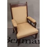 An Edwardian mahogany framed low armchair on reeded tapering supports, 57cm wide x 93cm high.