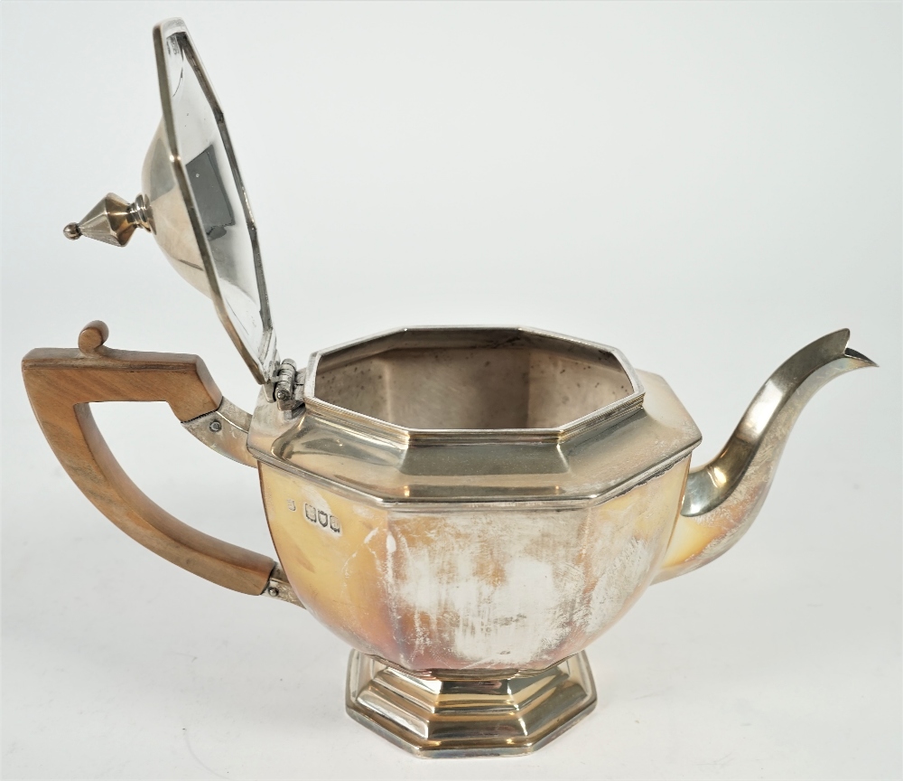 Silver tea wares, comprising; a teapot with a wooden handle, a twin handled sugar bowl, - Image 3 of 4