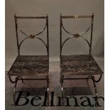 A pair of 20th century steel hall chairs with inset marble seats, 47cm wide x 105cm high, (2).