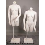 Two 20th century female torso mannequins on white metal bases, the tallest 156cm high, (2).