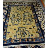A Peking Chinese carpet, the ivory field with four cartouche,