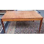 Gordon Russell; a mid-20th century rectangular extending dining table on tapering square supports,