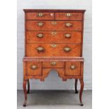 An early 18th century featherbanded oak and walnut chest on stand,