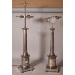 A pair of 20th century chrome table lamps, on tapering column square plinth base, 78cm high, (a.f.