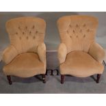 A pair of 20th century hardwood framed low armchairs with green button back upholstery,