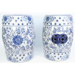 A pair of modern Chinese style blue and white pottery garden seats decorated with stylised flowers,