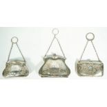 Three lady's silver purses, each having engraved decoration,