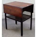 A George III mahogany drop flap supper table, with brass grille enclosed undertier,