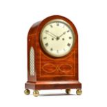 A mid-19th century mahogany and inlaid mantel clock with domed hood and seven inch painted tin dial