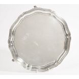 A Russian salver of shaped circular form, raised on three foliate feet, 1863, detailed 84,