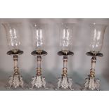 A group of four Victorian style single bronze table lamps, 58cm high.