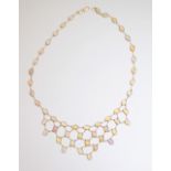 A gold and opal fringe necklace, collet set with oval cabochon opals,