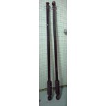 A pair of 20th century black painted beech curtain rails, 227cm long (2), (4 brass brackets).