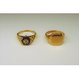 A gold signet ring, ring size Q and a 9ct gold, sapphire and diamond nine stone cluster ring,