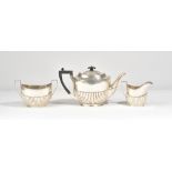 Silver tea wares, comprising; a teapot of oval form,