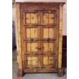 An early 20th century Indian hardwood two door side cupboard, 127cm wide x 200cm high.