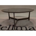 A 20th century patinated metal and glass circular coffee table, 80cm diameter x36cm high.