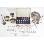 Silver, comprising; ten various teaspoons, an acorn shaped pepperette and a lidded trophy cup,