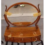 An early 19th century mahogany toilet mirror with bow three drawer base, 52cm wide x 55cm high.