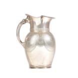 An American silver water jug, the body with engraved decoration,