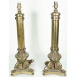 A pair of gilt metal table lamps, early 20th century,