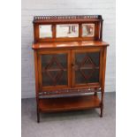 A 19th century mahogany side cabinet, the mirrored and pierced fret ledge back on cluster columns,