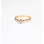 An 18ct gold and diamond single stone ring, claw set with a circular cut diamond, ring size K,
