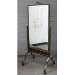 A 20th century French metal framed cheval mirror on four downswept supports, 80cm wide x 182cm high.