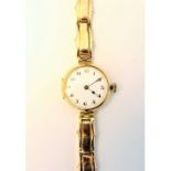 A lady's 9ct gold circular cased wristwatch, with a jewelled movement,
