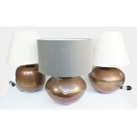 A pair of modern copper table lamps,