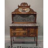 An Edwardian walnut and marble topped sideboard with mirrored back on turned supports,