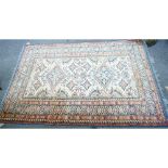 A Shirvan rug, caucasian, the ivory field with two diamonds, other motifs,