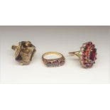 A 9ct gold and garnet set marquise shaped cluster ring,