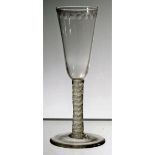 An opaque twist ale glass, circa 1765, the rounded funnel bowl engraved with an `oxo' border,