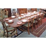 A George III style mahogany extending dining table, on six downswept supports,