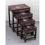 A nest of four 20th century Chinese mother-of-pearl inlaid occasional tables, on block supports,