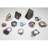 A silver ring, mounted with an oval cut amethyst,