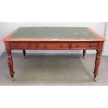 A Victorian mahogany centre library writing desk with three frieze drawers and matching opposing,