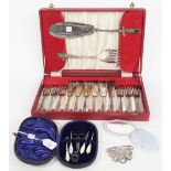 A set of six pairs of plated fish knives and forks and a pair of matching fish servers, cased,