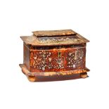 A Regency mother-of-pearl inlaid tortoiseshell tea caddy, with swept top and bow front,