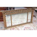 A Regency gilt framed overmantel mirror, with inverted ball and shell mounted frieze,