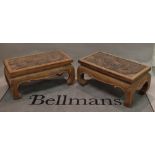 A pair of 20th century Chinese hardwood rectangular coffee tables with carved inset tops,