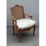 A late 18th century Continental carved walnut open armchair,