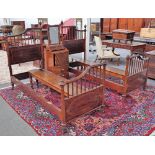 Garnett's Warrington; a pair of early 20th century inlaid mahogany asymmetrical single beds,