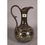 A Doulton Lambeth stoneware ewer, 29cm high.